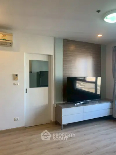 Modern living room with sleek TV setup and stylish decor