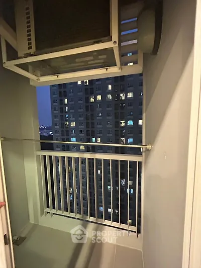 Cozy balcony with city view in modern high-rise apartment