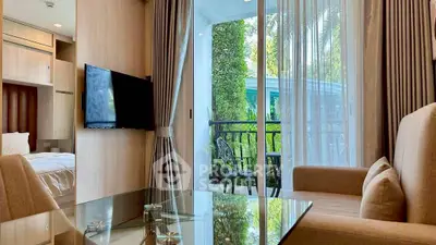 Modern living room with glass table and balcony view in luxury apartment