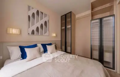 Modern bedroom with stylish decor and ample storage space