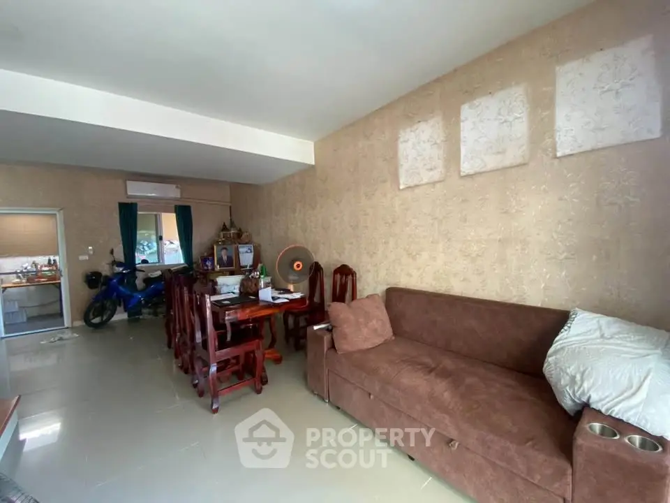 Spacious living room with elegant furniture and open layout, perfect for family gatherings.