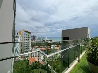 Stunning balcony view overlooking city skyline and ocean, perfect for urban living.