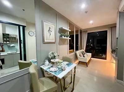 Modern living room with elegant dining area and city view, perfect for urban living.