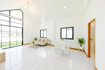 Spacious modern living room with high ceilings and large windows