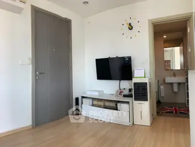 Modern living room with wall-mounted TV and stylish decor
