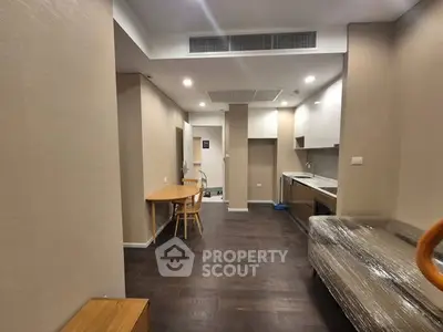 Modern apartment interior with open layout and sleek kitchen design