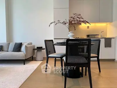 Modern living room with stylish dining area and elegant decor