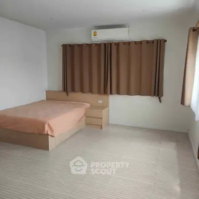 Spacious bedroom with minimalist design and natural light