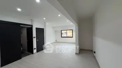 Spacious modern living room with sleek design and natural light