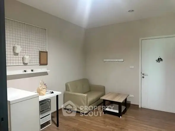 Cozy small living room with modern furniture and wooden flooring