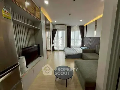 Modern studio apartment with cozy living area and stylish decor