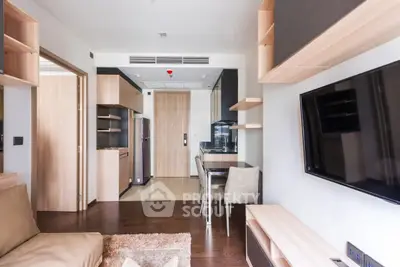 Modern living room with open kitchen and sleek wooden finishes