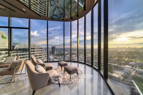 Luxurious high-rise living room with panoramic city views and modern furnishings.