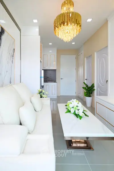 Luxurious living room with elegant chandelier and modern decor