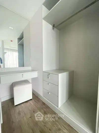 Spacious walk-in closet with modern design and ample storage space