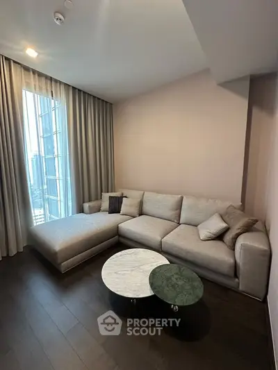 Modern living room with stylish sectional sofa and city view