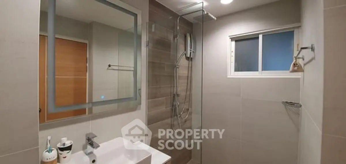 Modern bathroom with sleek design and glass shower enclosure