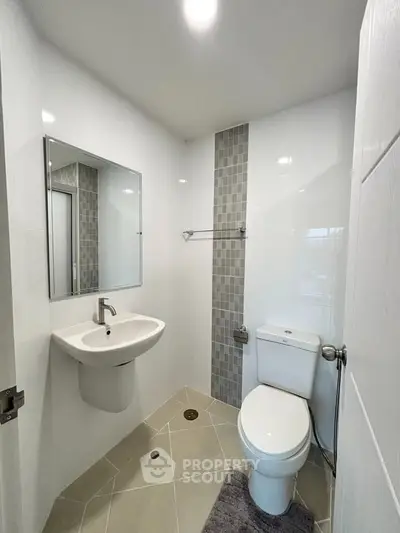 Modern bathroom with sleek fixtures and stylish tile accents