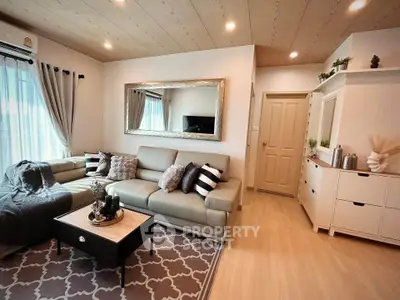 Stylish living room with modern decor, cozy seating, and elegant lighting.
