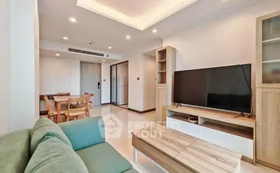 Spacious modern living room with sleek furniture and open layout, perfect for relaxation and entertainment.