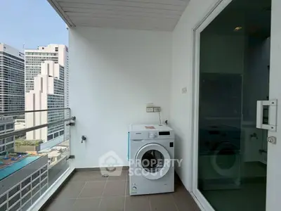 Modern balcony with washing machine and city view, perfect for urban living.