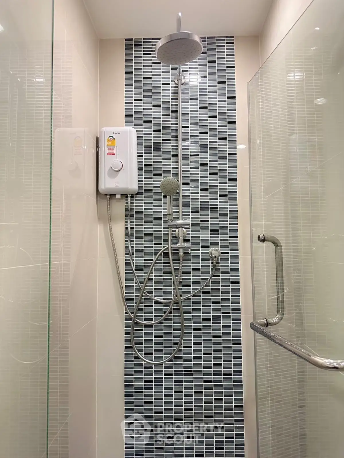 Modern bathroom shower with stylish tile design and glass door
