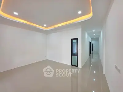 Spacious modern interior with sleek lighting and glossy flooring, perfect for customization.