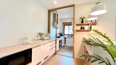 Modern kitchen with sleek design and open layout, featuring stylish cabinetry and appliances.