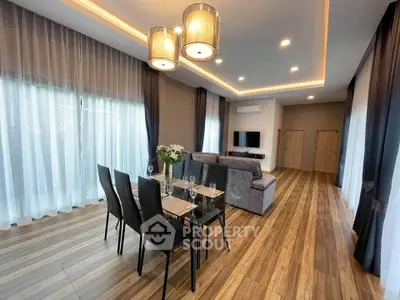 Spacious modern living room with elegant dining area and stylish lighting