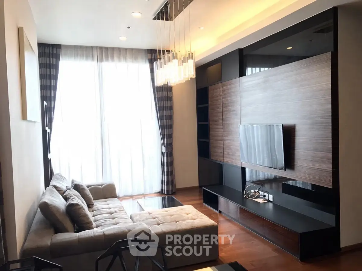 Modern living room with stylish decor and large windows for natural light