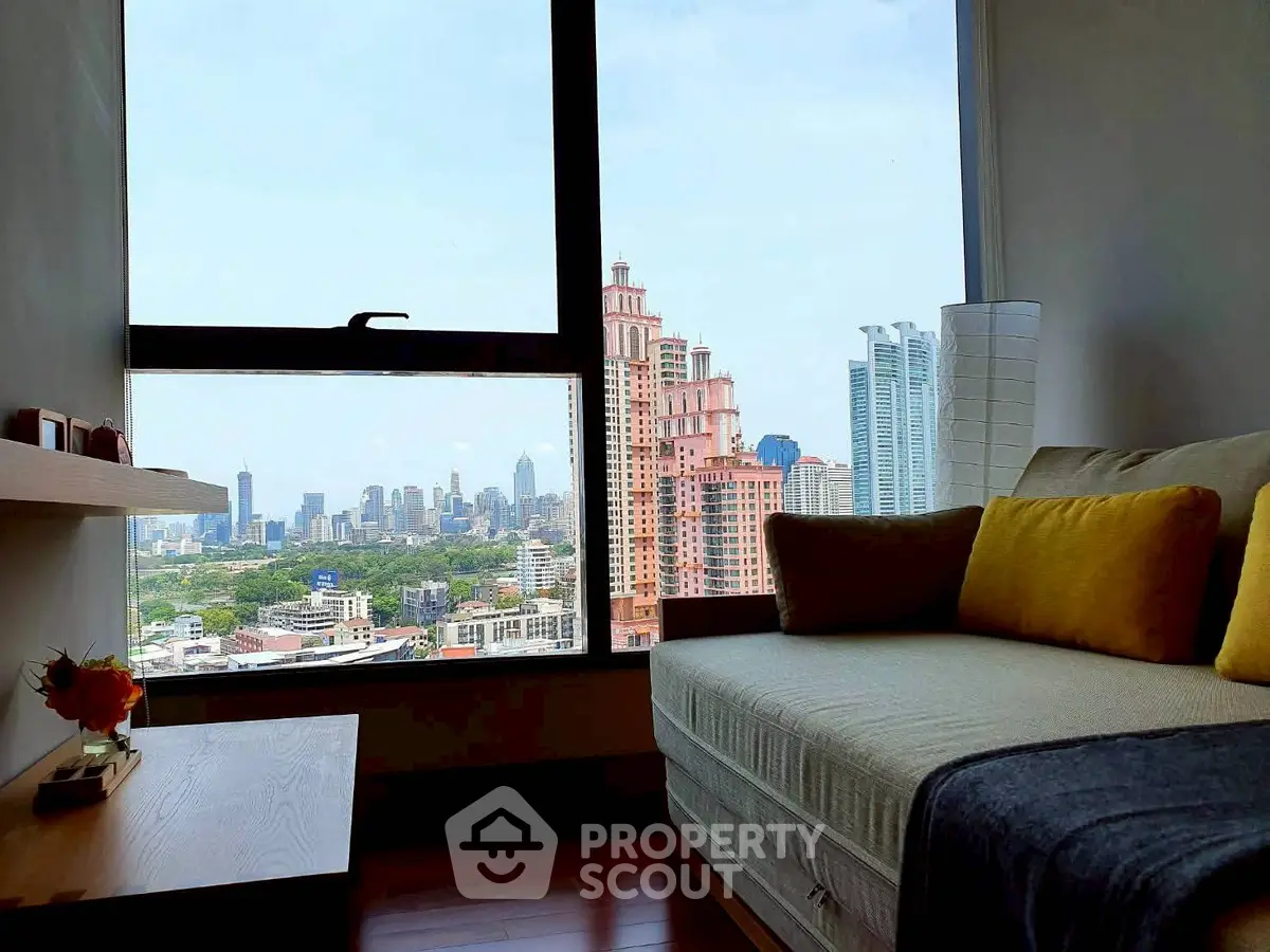 Stunning city view from modern living room with cozy seating and elegant decor.
