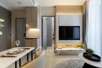 Modern living room with stylish decor and wall-mounted TV, featuring elegant dining area and natural light.