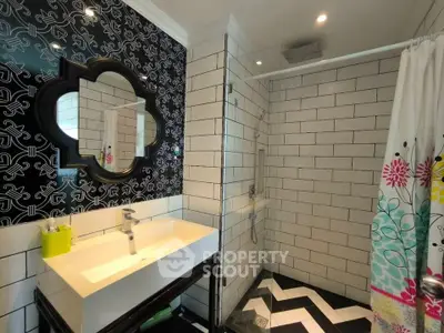 Stylish modern bathroom with geometric tiles and elegant fixtures