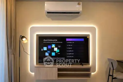 Modern living room with stylish TV setup and ambient lighting