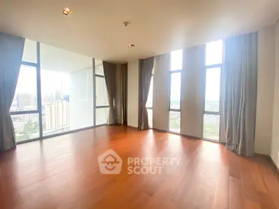 Spacious corner unit with floor-to-ceiling windows and stunning city views.