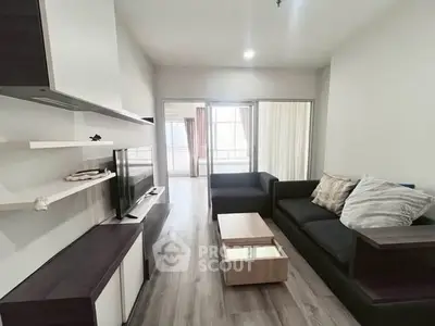 Modern living room with sleek furniture and open layout in a stylish apartment.