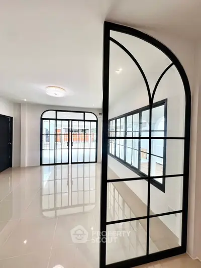 Modern interior with elegant glass partitions and glossy tiled flooring