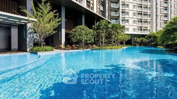 Luxurious condominium with stunning pool and lush greenery, perfect for relaxation and leisure.