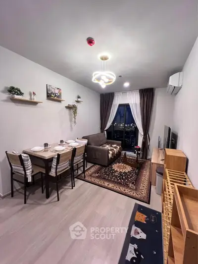 Modern living room with dining area and city view, featuring stylish decor and cozy ambiance.