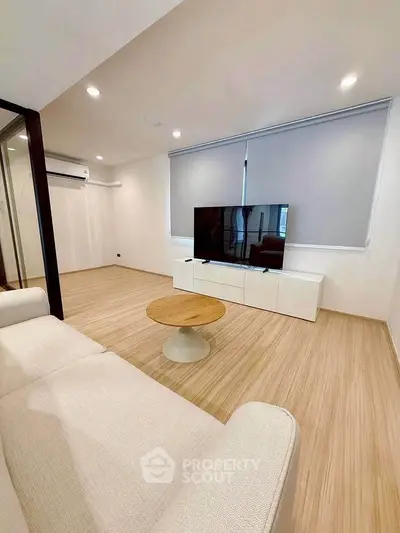 Modern living room with sleek TV setup and stylish furniture