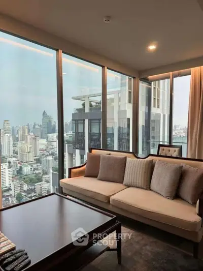 Luxurious living room with panoramic city view in high-rise apartment