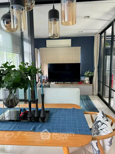 Stylish modern living room with elegant decor and large TV