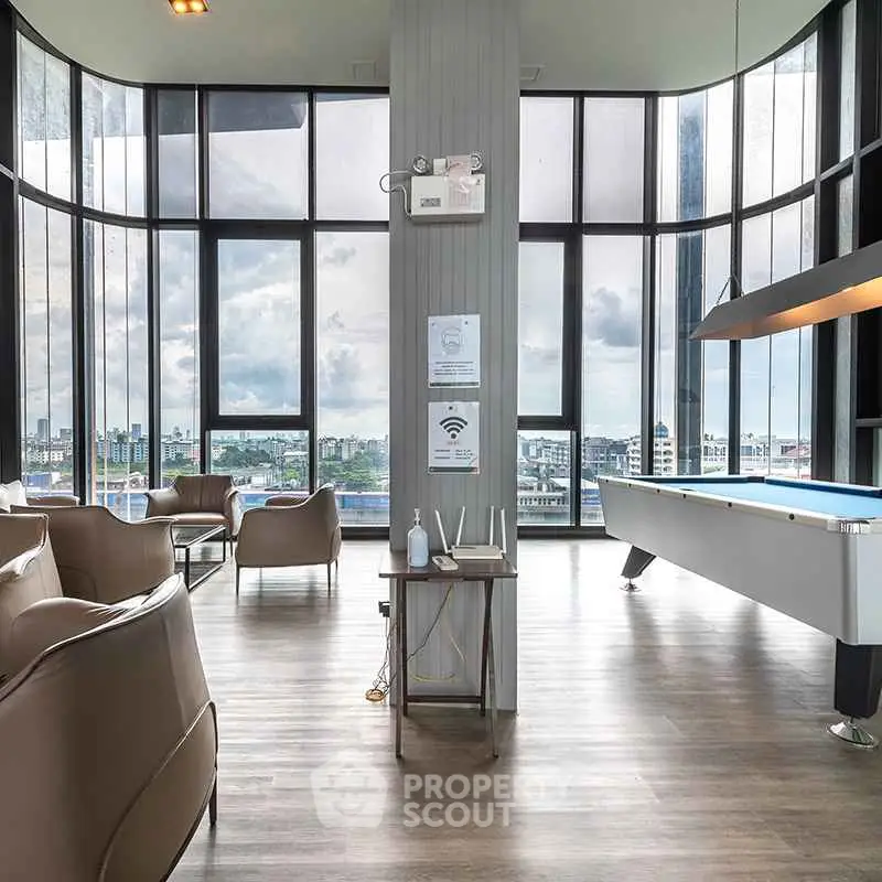 Luxurious high-rise lounge with panoramic city views and modern furnishings.