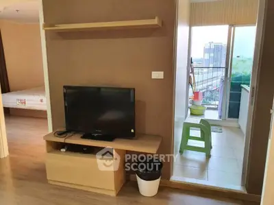 Modern apartment interior with TV and balcony view