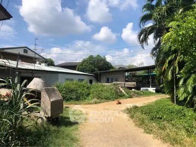 Charming rural property with lush greenery and spacious outdoor area, perfect for serene living.