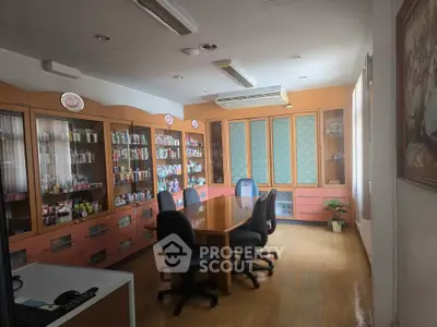 Spacious office meeting room with wooden cabinets and large table