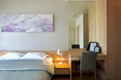 Modern bedroom with stylish decor and cozy ambiance, featuring a comfortable bed and elegant furnishings.
