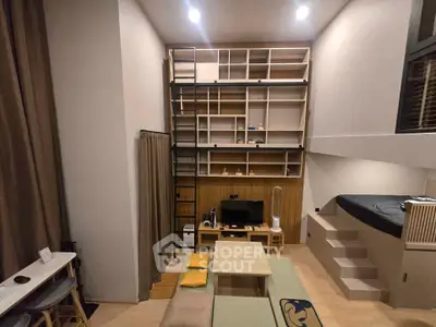 Modern loft-style living room with high ceilings and built-in shelving