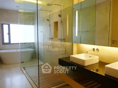 Luxurious modern bathroom with dual showers and freestanding bathtub