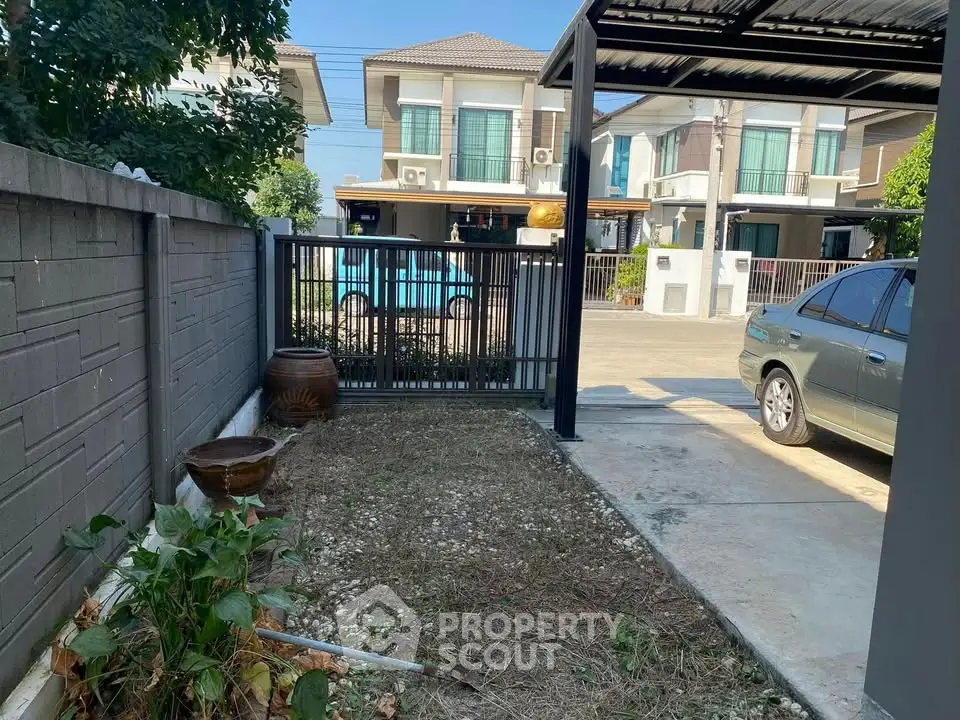 Charming suburban home with driveway and garden space, perfect for family living.